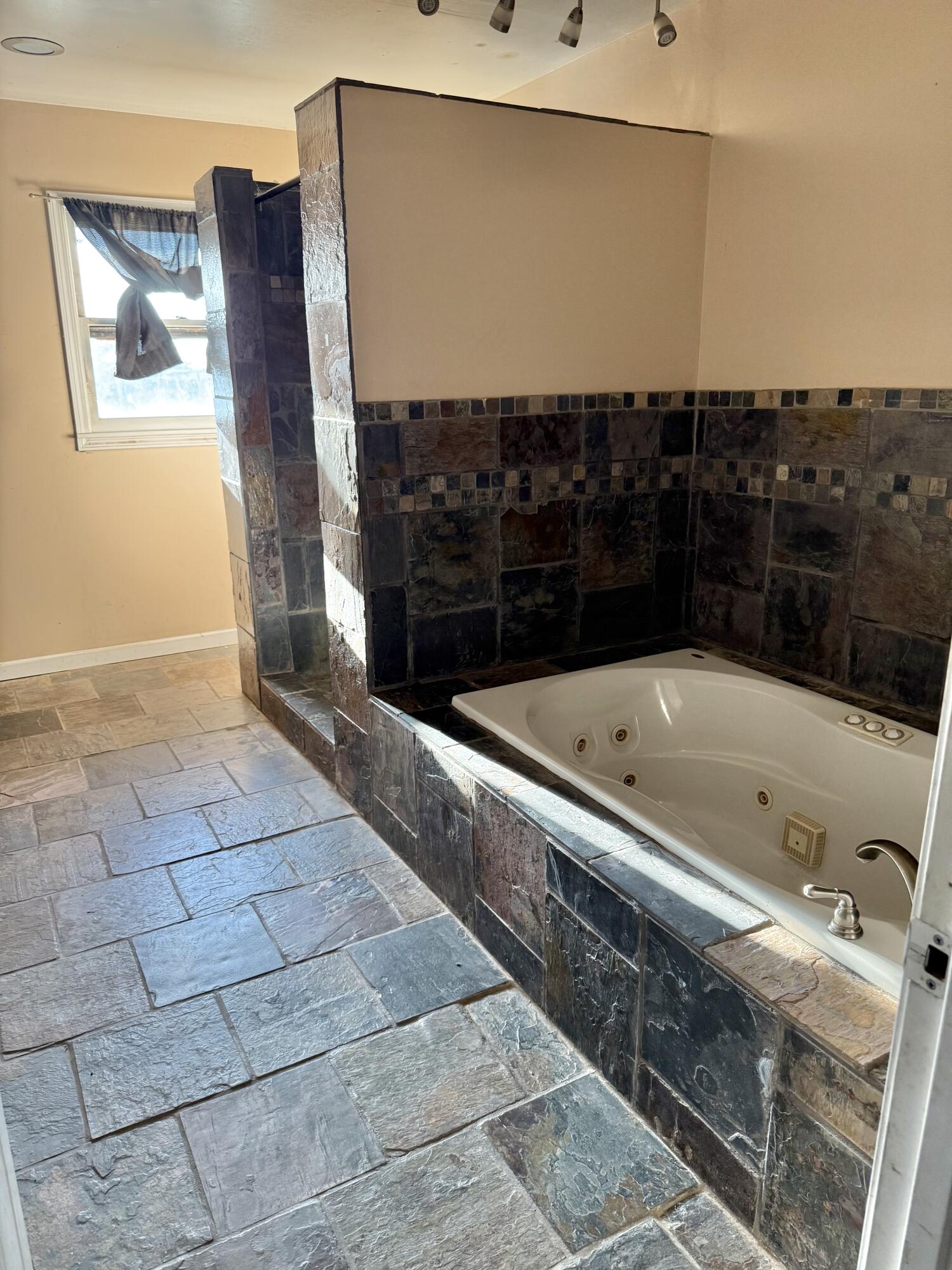 150 FM 2079 Muleshoe, TX 79347 - Photo 10 of 26 a bathroom with a bathtub and a shower