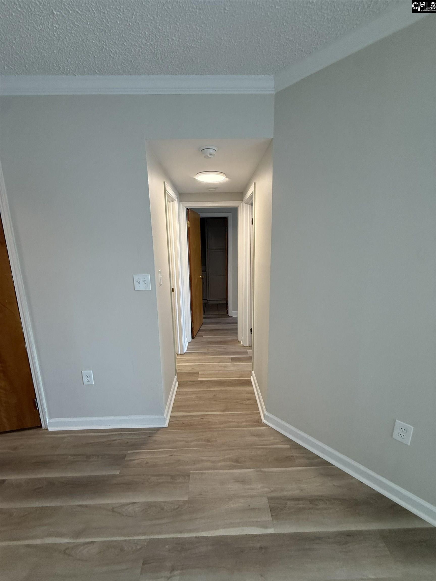 2002 Greene Street, Unit 209 Columbia, SC 29205 - Photo 12 of 22 a view of a hallway with wooden floor
