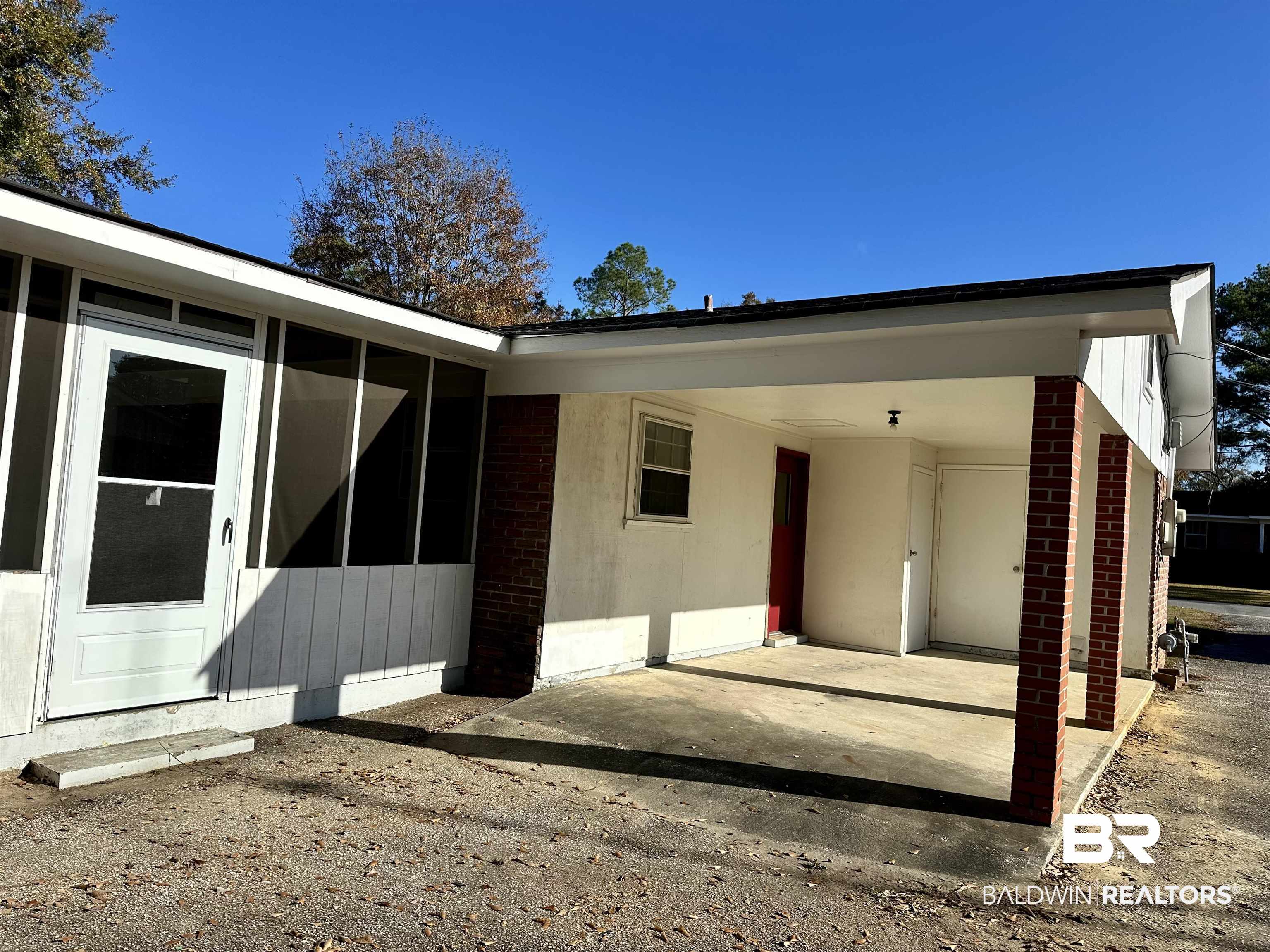 103 Avalon Street Brewton, AL 36426 - Photo 13 of 14 Exterior space featuring a carport