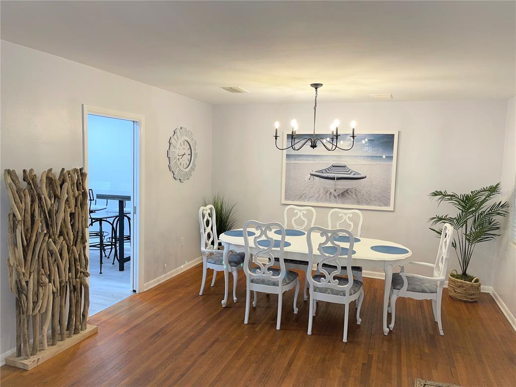 1963 Ripon Drive Clearwater, FL 33764 - Photo 4 of 29 a view of a dining room with furniture and wooden floor