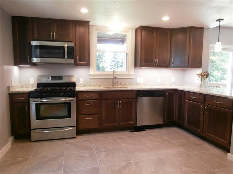 118 Bellevue Road Pittsburgh, PA 15229 - Photo 8 of 25 New Eat In Kitchen w/Maple Wood Cabinetry w/Under Mount Lighting, Soft Close Drawers, Fully Equipped w/Stainless Steel Appliances. Granite Counter Tops and Island