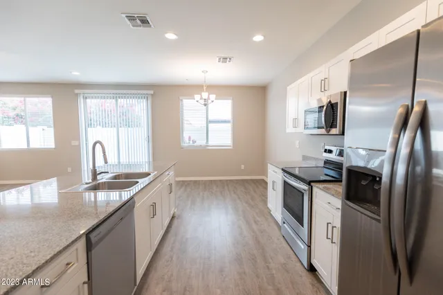a view of a backyard with potted plants
