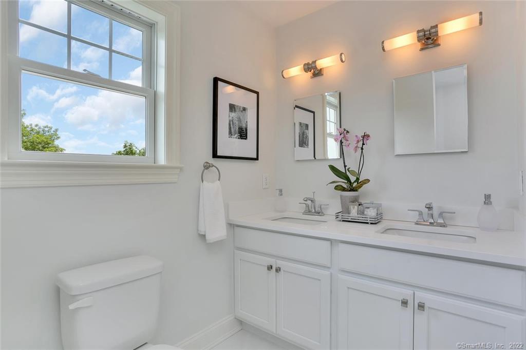 8 View Street, Unit 10 Greenwich, CT 06830 - Photo 14 of 29 a bathroom with a sink a toilet and a mirror