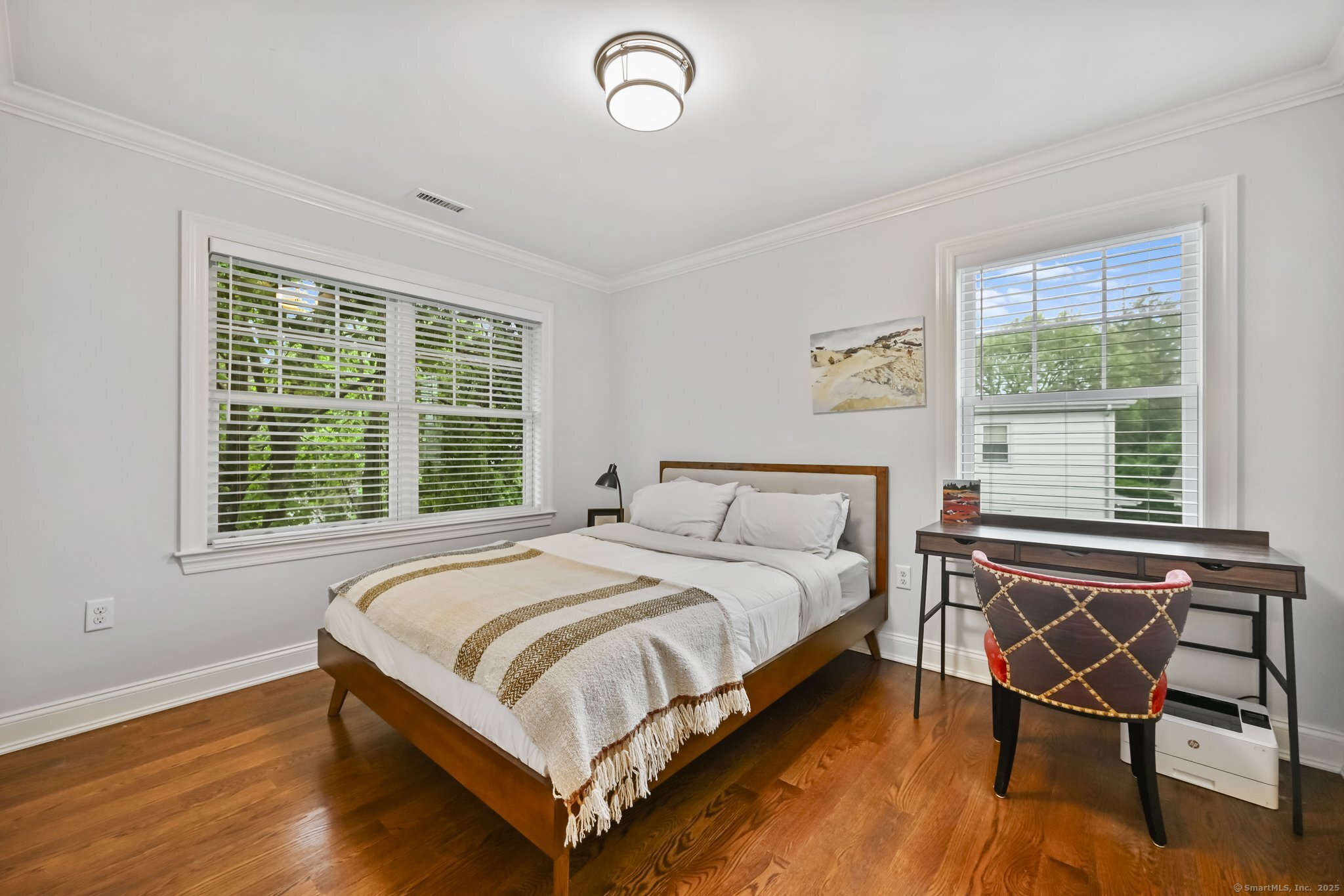 8 View Street, Unit 10 Greenwich, CT 06830 - Photo 18 of 29 a bedroom with a bed chair and a window