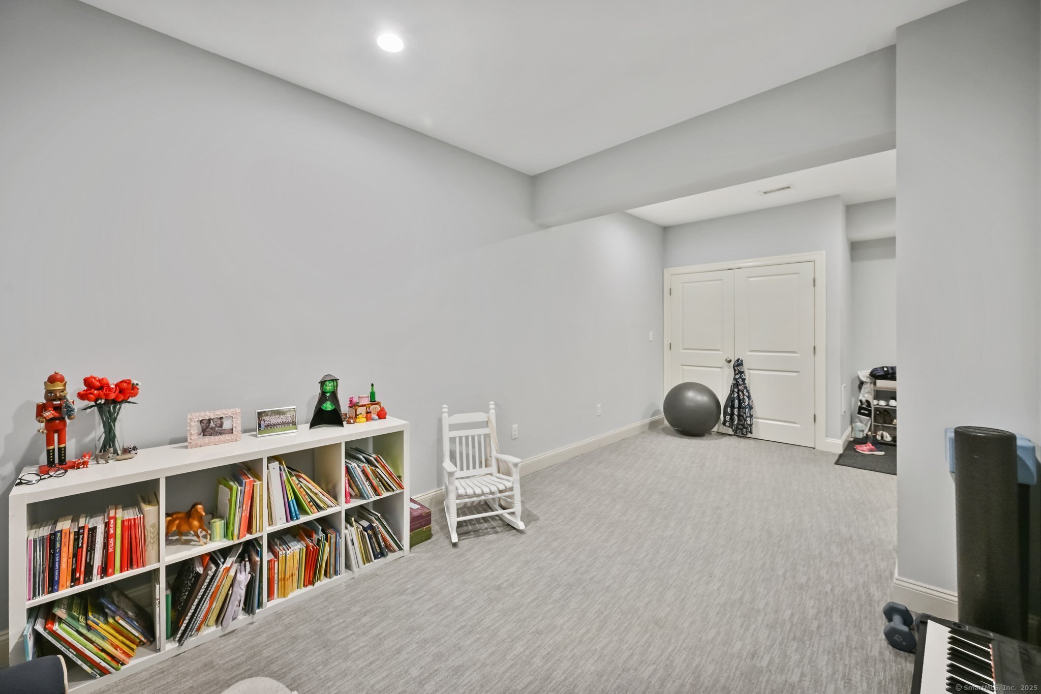 8 View Street, Unit 10 Greenwich, CT 06830 - Photo 19 of 29 a room with furniture and a book shelf