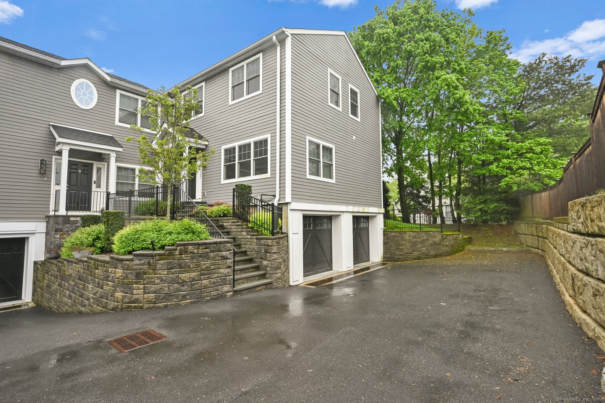 8 View Street, Unit 10 Greenwich, CT 06830 - Photo 24 of 29 a front view of a house with a garden