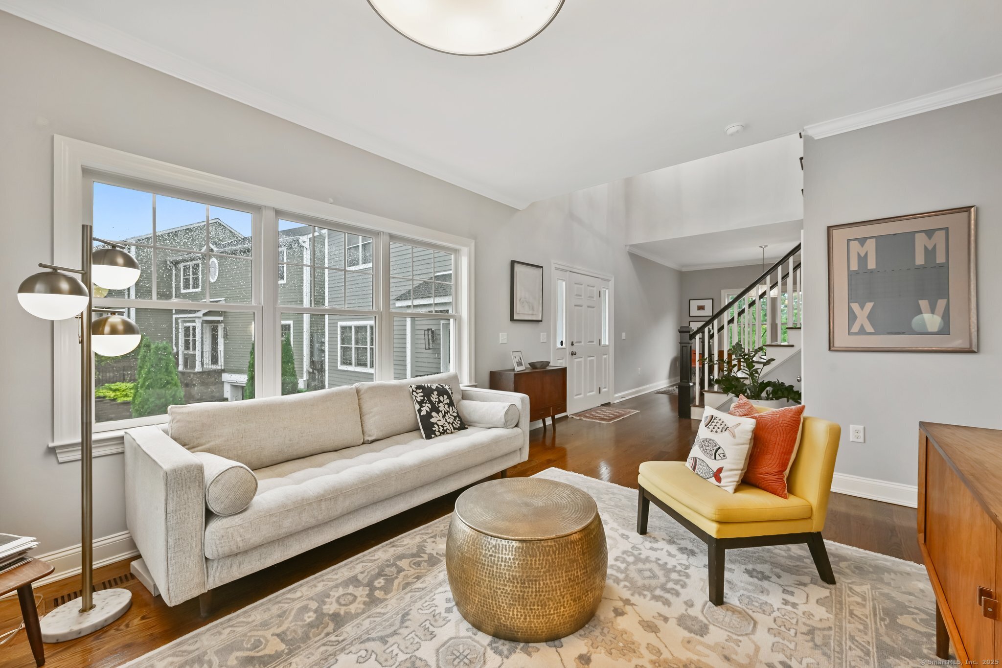 8 View Street, Unit 10 Greenwich, CT 06830 - Photo 4 of 29 a living room with furniture and a large window