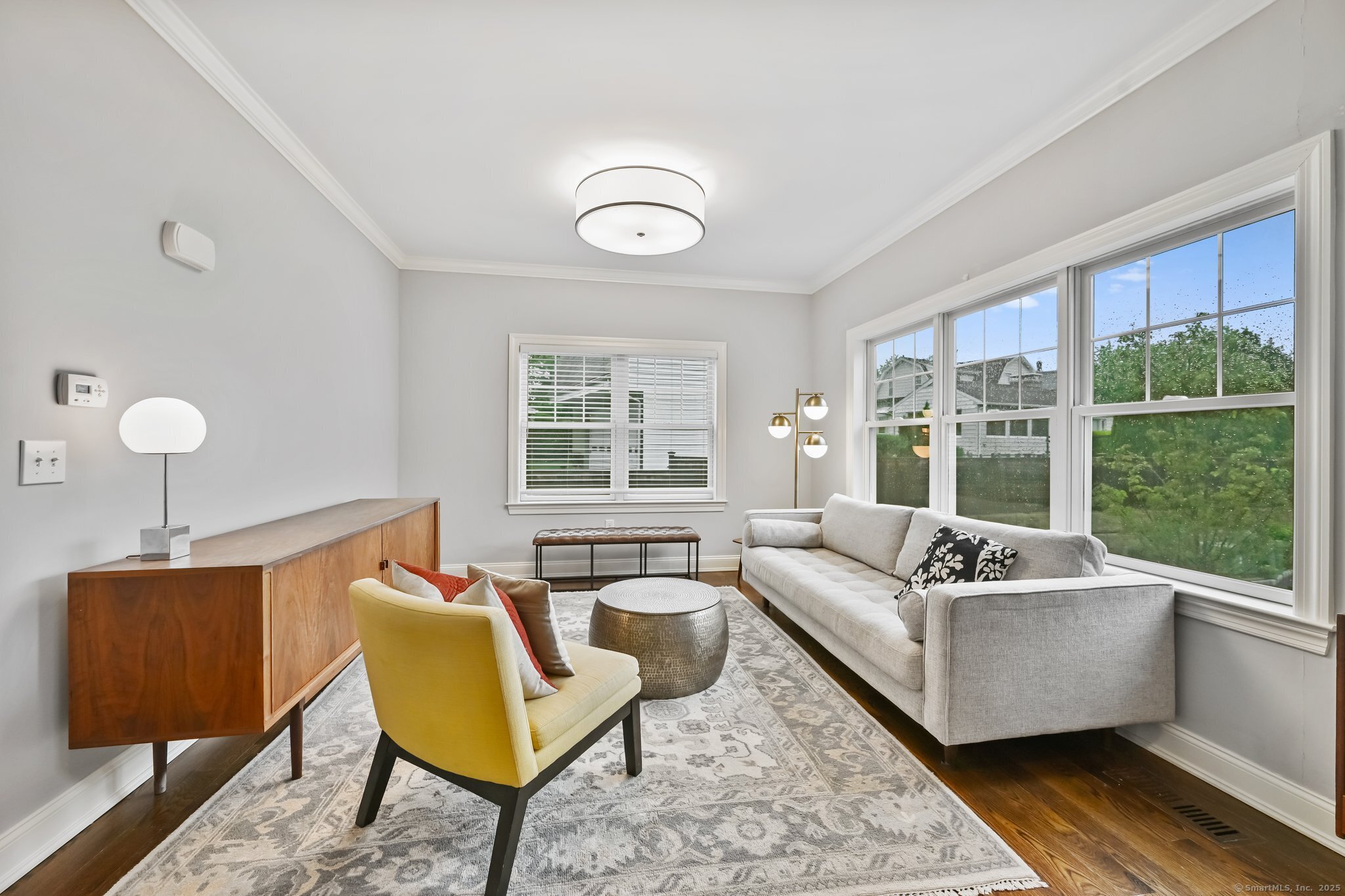 8 View Street, Unit 10 Greenwich, CT 06830 - Photo 5 of 29 a living room with furniture and a window