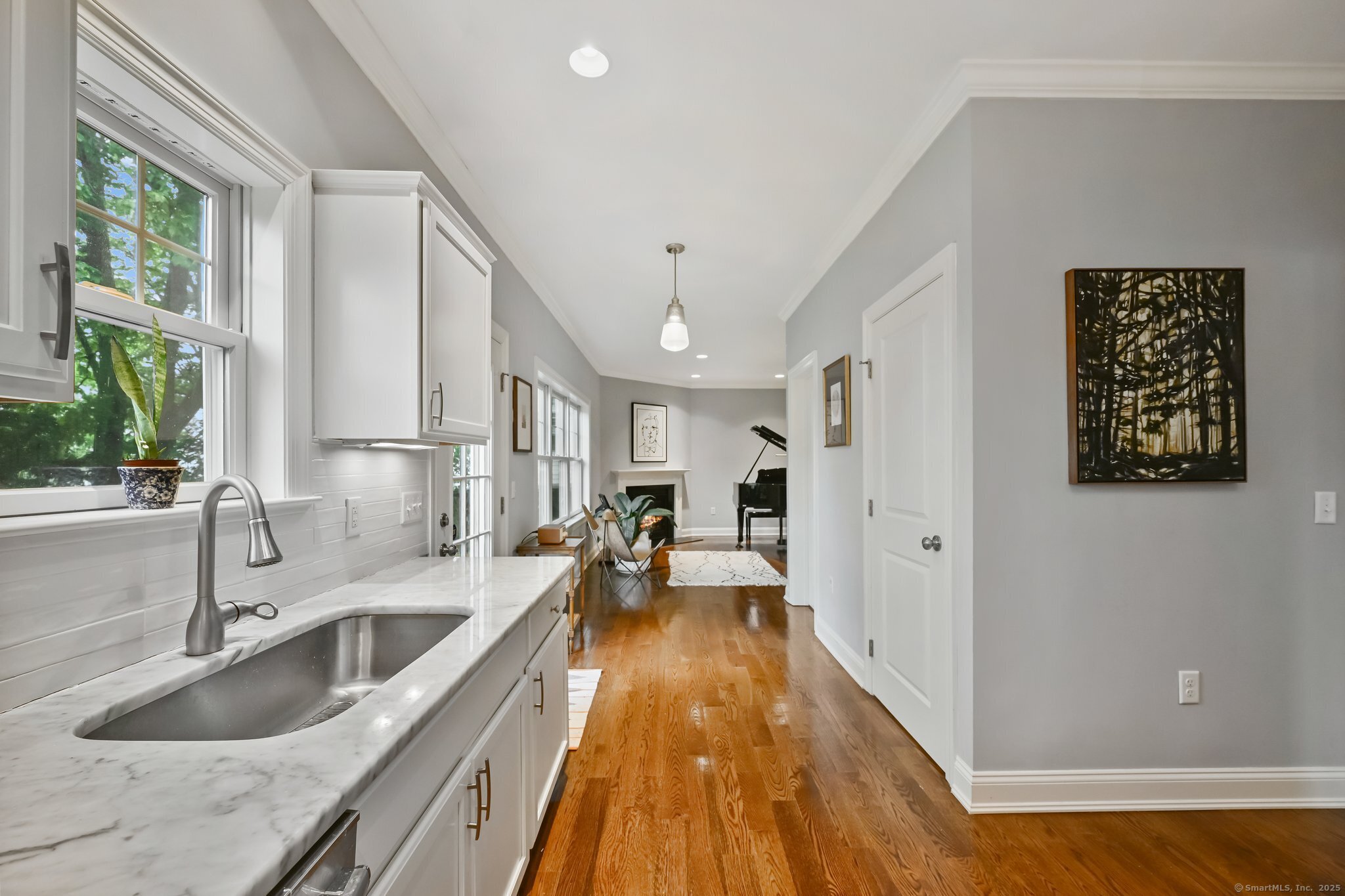 8 View Street, Unit 10 Greenwich, CT 06830 - Photo 9 of 29 a view of a kitchen with a sink dishwasher stove and wooden cabinets