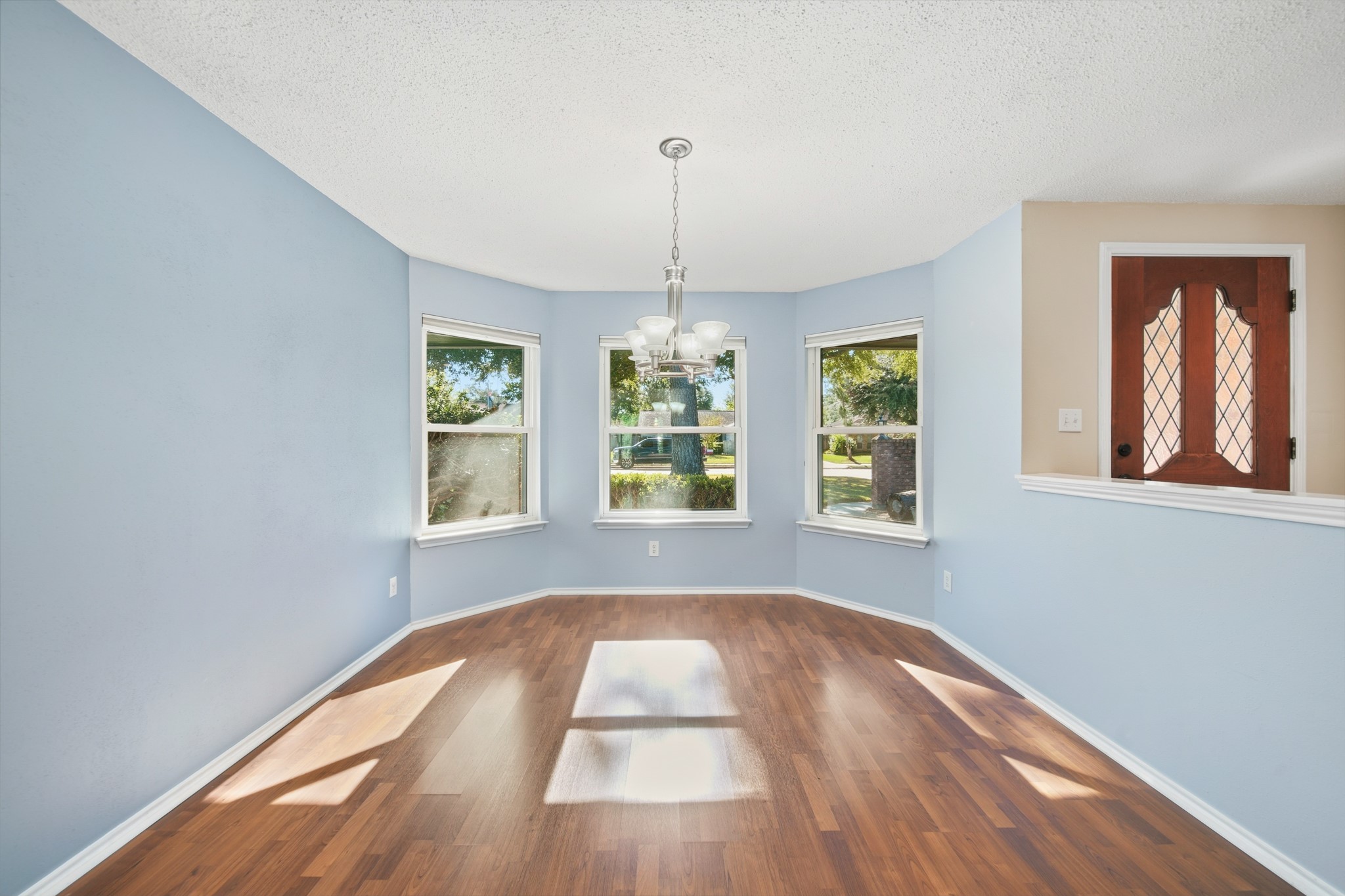 9518 Dundalk Street Spring, TX 77379 - Photo 11 of 46 a view of empty room with wooden floor and fan