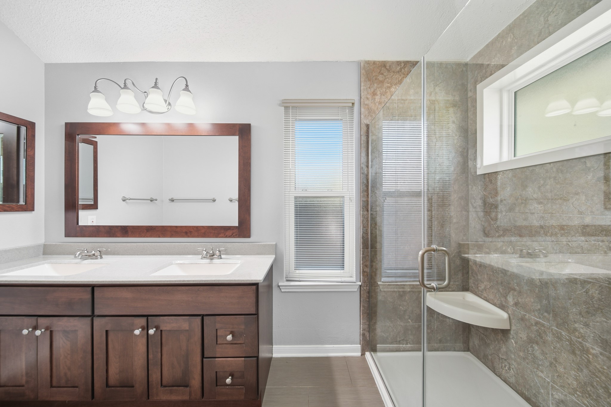 9518 Dundalk Street Spring, TX 77379 - Photo 24 of 46 a bathroom with a sink a toilet and a mirror