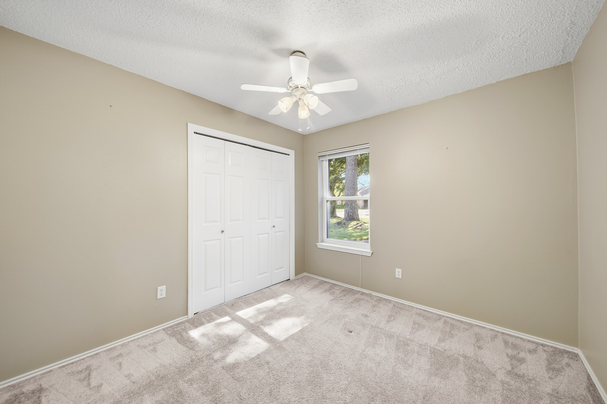 9518 Dundalk Street Spring, TX 77379 - Photo 28 of 46 a view of an empty room with a window