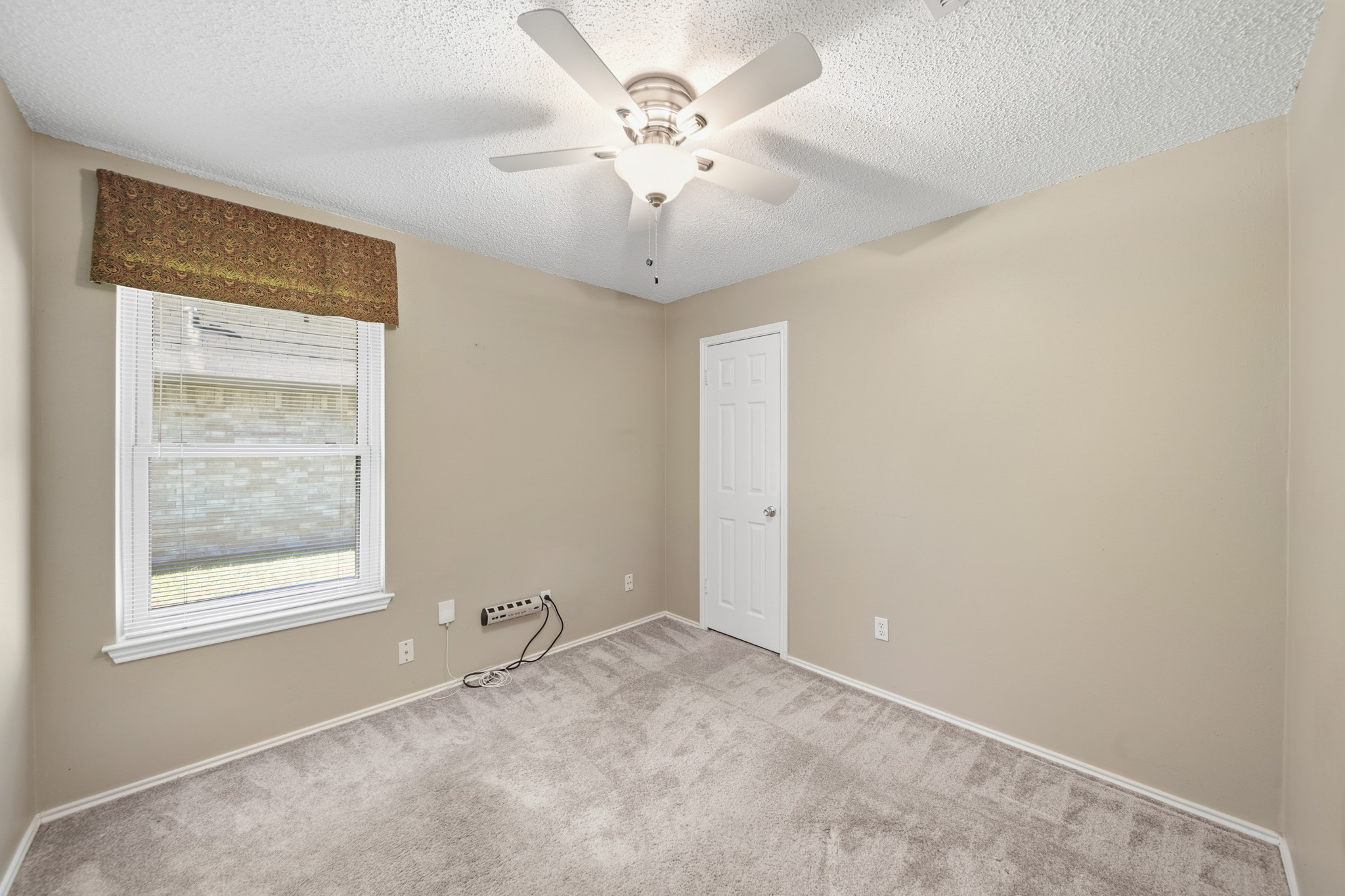 9518 Dundalk Street Spring, TX 77379 - Photo 32 of 46 a view of an empty room with a window
