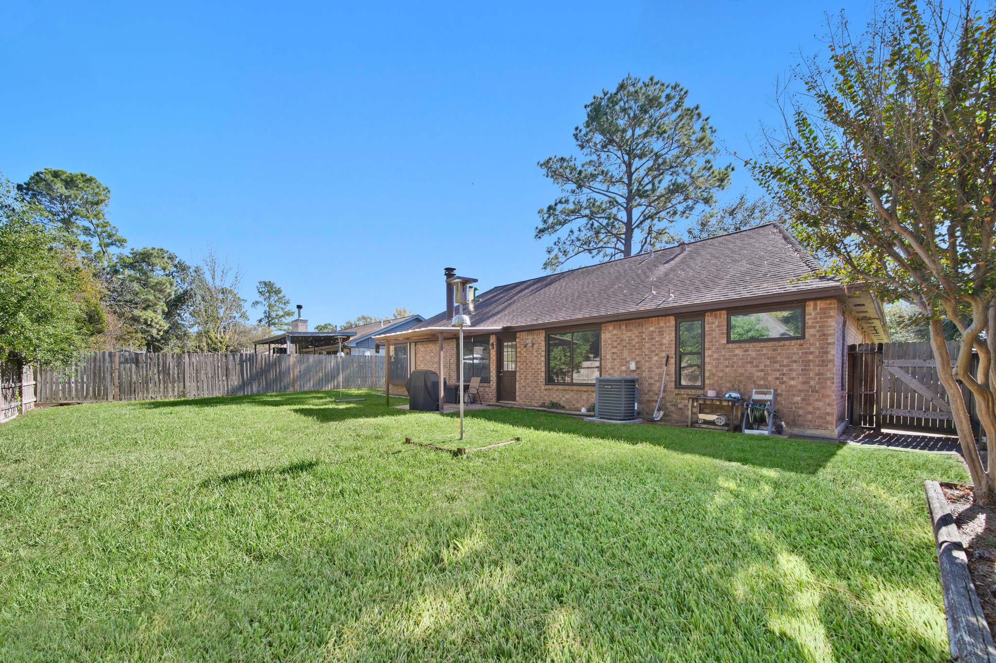 9518 Dundalk Street Spring, TX 77379 - Photo 36 of 46 a view of a yard in front of a house