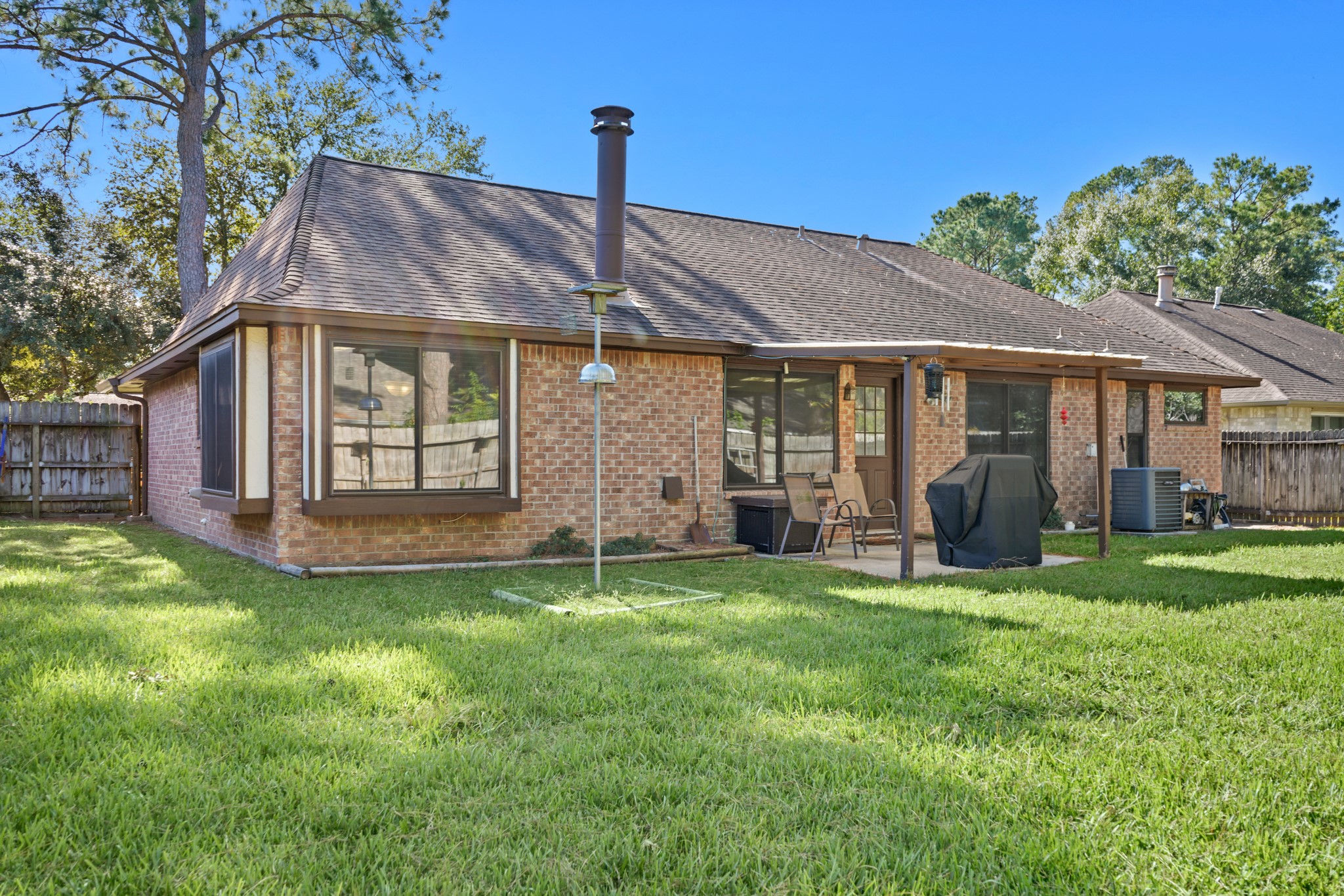 9518 Dundalk Street Spring, TX 77379 - Photo 39 of 46 a front view of a house with a garden