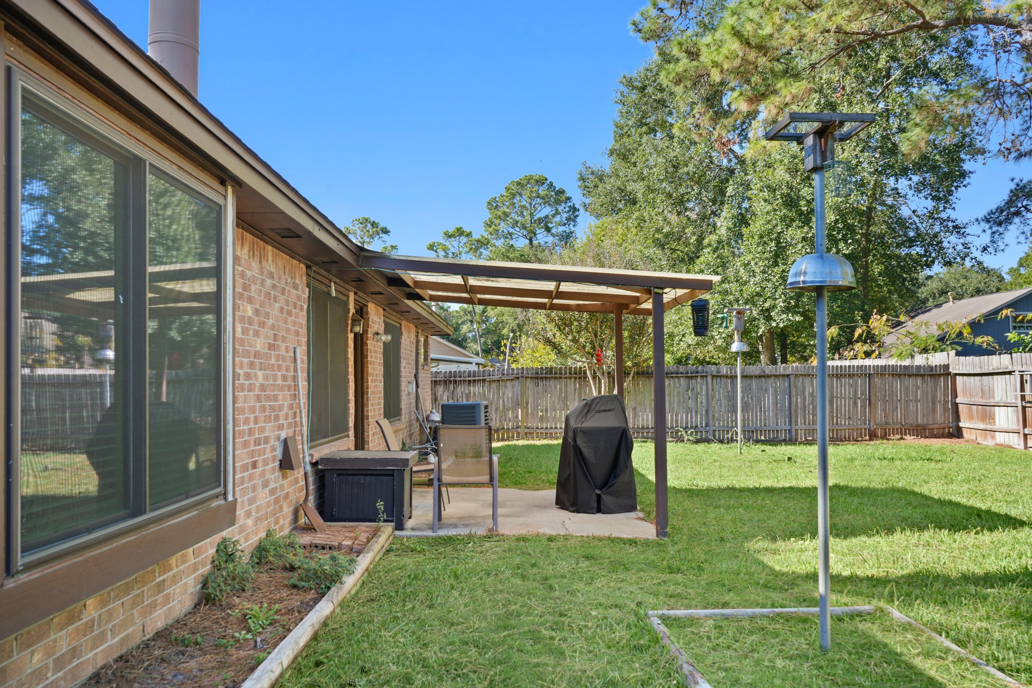 9518 Dundalk Street Spring, TX 77379 - Photo 40 of 46 a view of a porch with a backyard