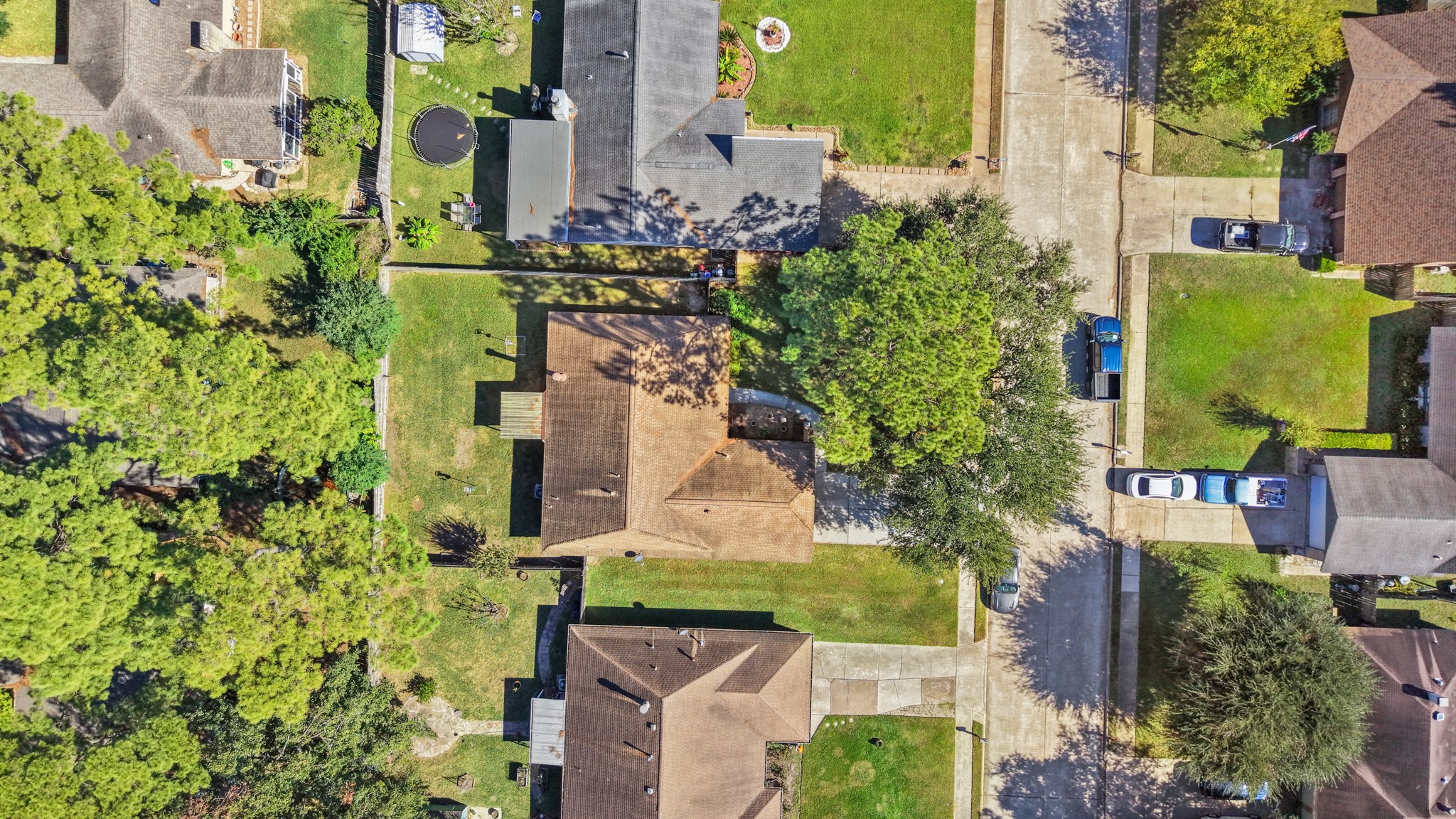9518 Dundalk Street Spring, TX 77379 - Photo 41 of 46 an aerial view of a house with a yard basket ball court and outdoor seating