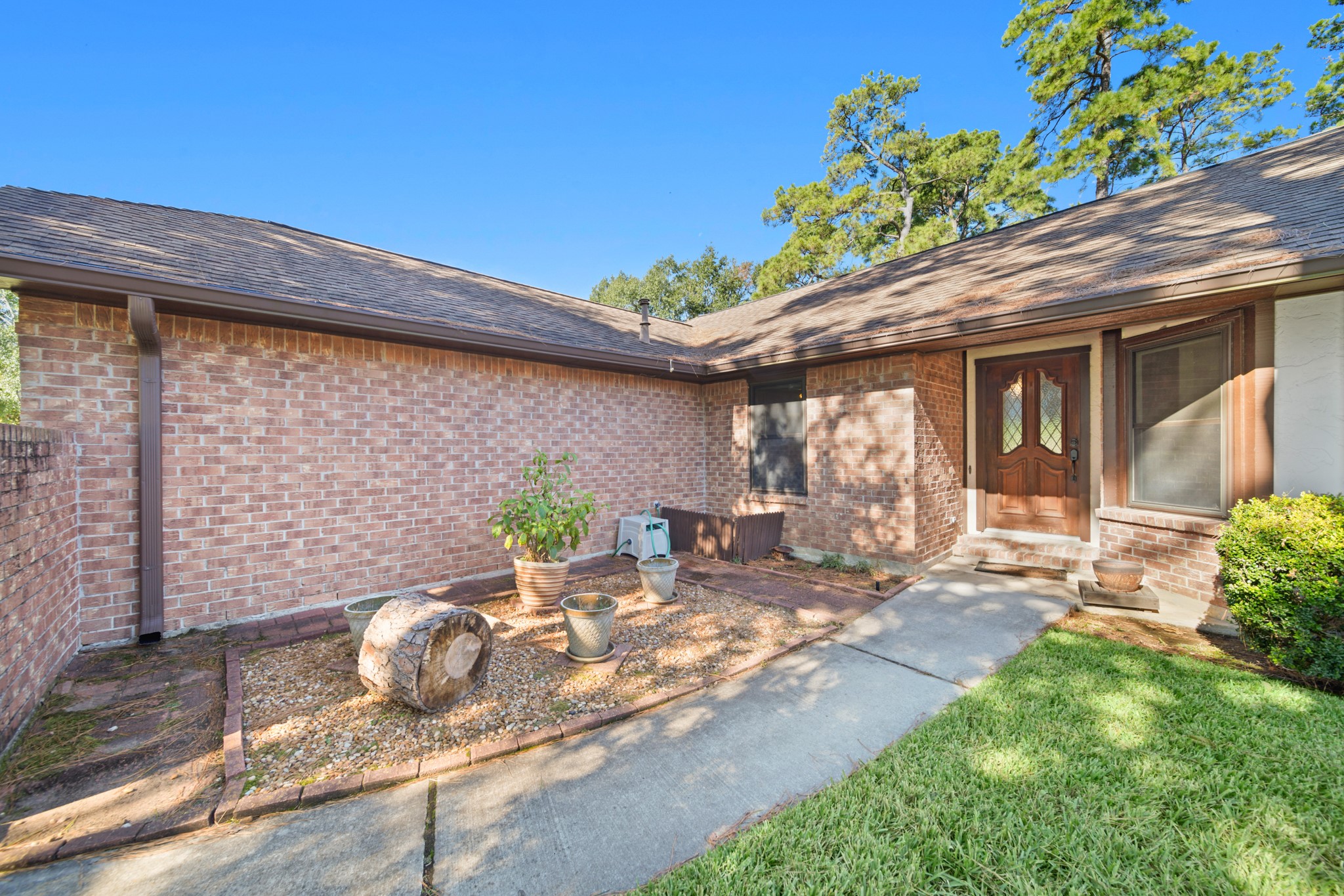 9518 Dundalk Street Spring, TX 77379 - Photo 6 of 46 a front view of a house with patio
