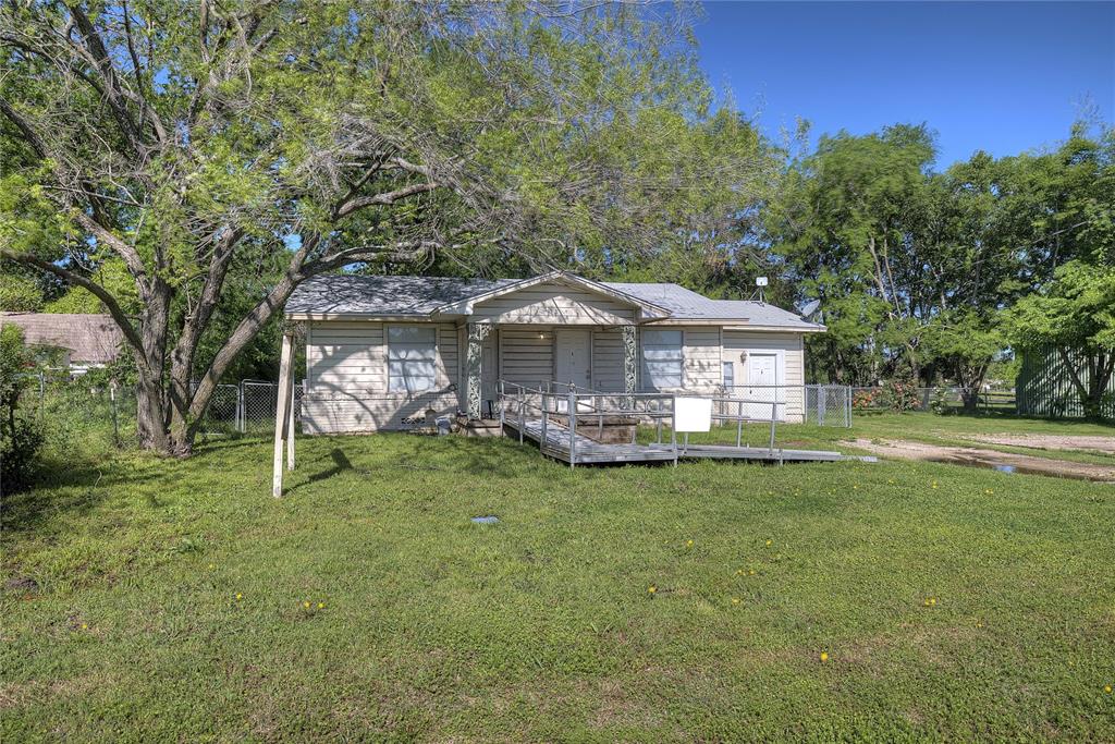 8782 Highway 34 Quinlan, TX 75474 - Photo 15 of 37 a front view of a house with garden