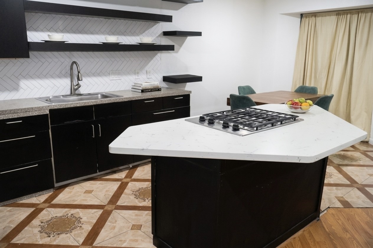 2203 South Houston Road Pasadena, TX 77502 - Photo 8 of 18 Granite counter tops on island with cooking surface.