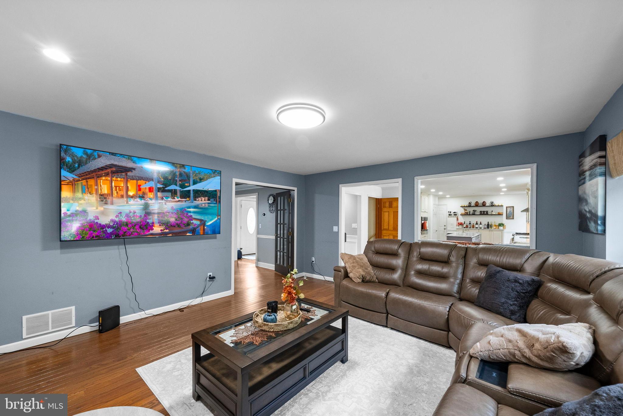 40 Doe Drive Hamilton, NJ 08620 - Photo 19 of 62 a living room with furniture and a flat screen tv