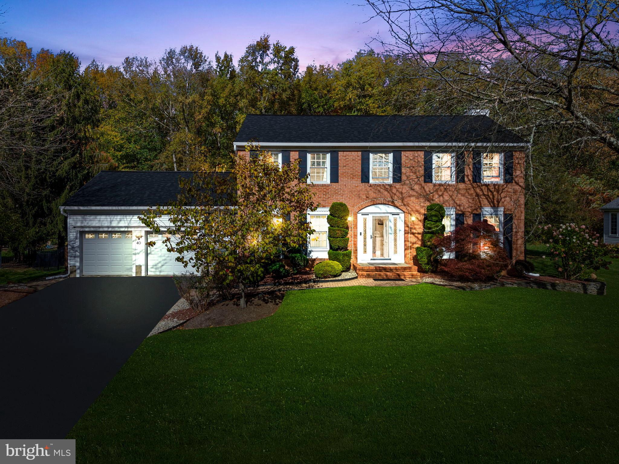 40 Doe Drive Hamilton, NJ 08620 - Photo 2 of 62 a front view of a house with a garden