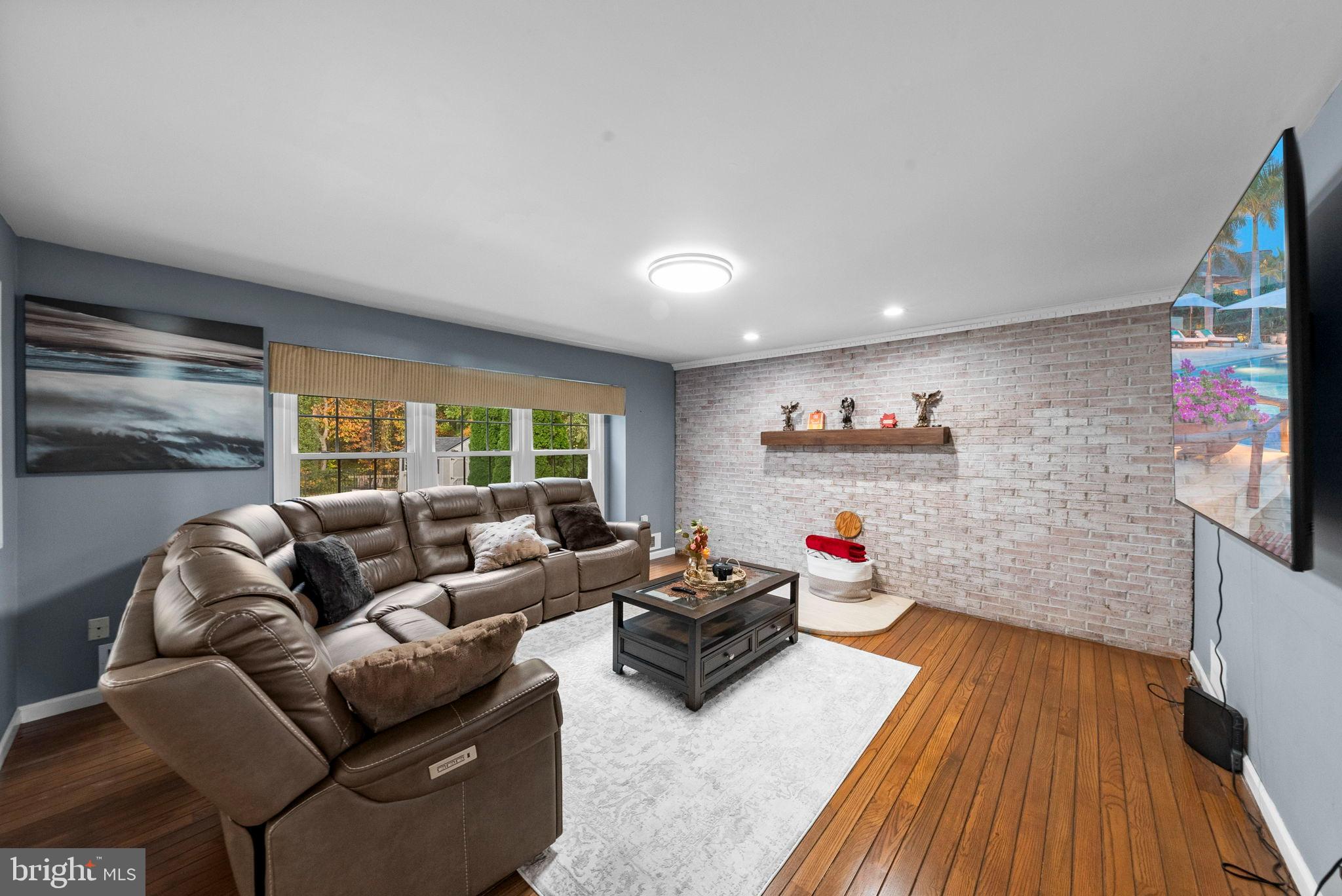 40 Doe Drive Hamilton, NJ 08620 - Photo 21 of 62 a living room with furniture and a flat screen tv