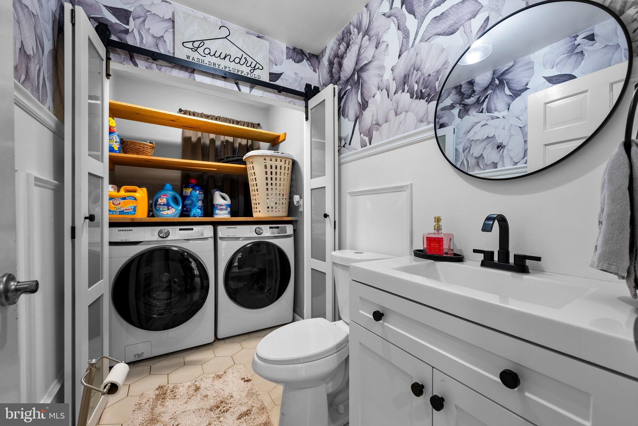 40 Doe Drive Hamilton, NJ 08620 - Photo 24 of 62 a bathroom with a toilet a sink and a mirror