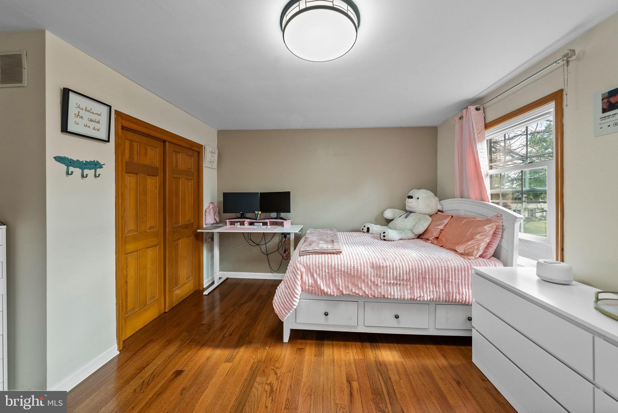 40 Doe Drive Hamilton, NJ 08620 - Photo 33 of 62 a bedroom with a bed and wooden floor