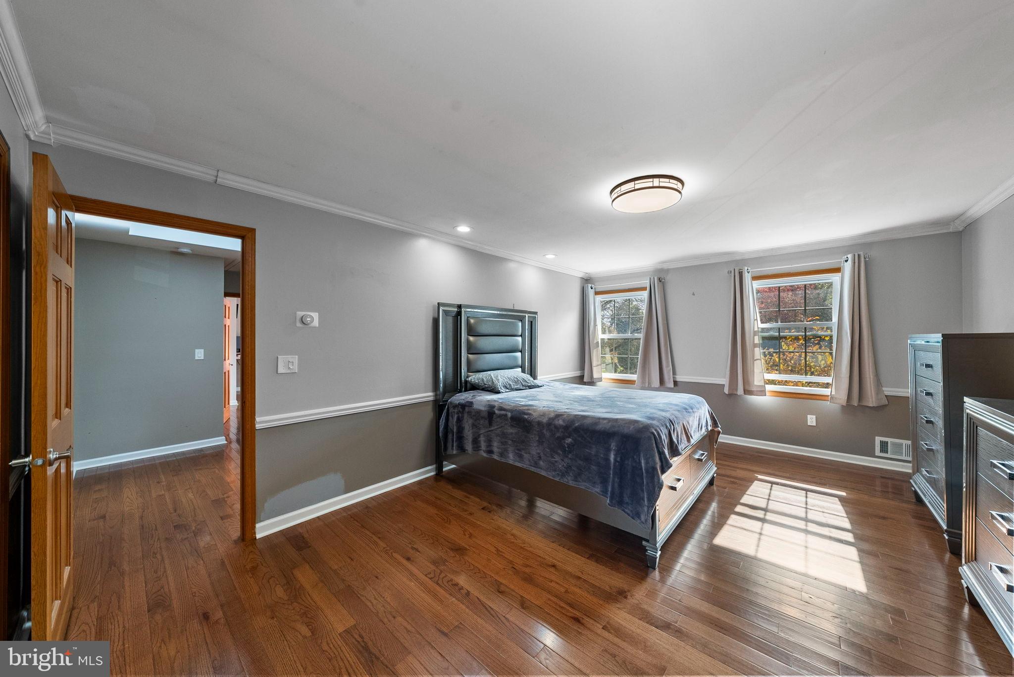 40 Doe Drive Hamilton, NJ 08620 - Photo 36 of 62 a spacious bedroom with a bed and wooden floor