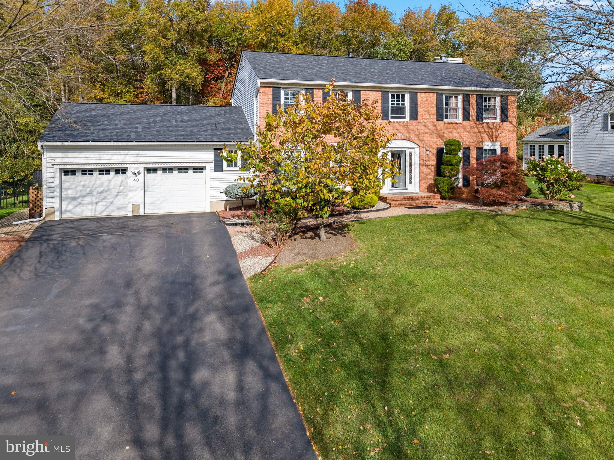 40 Doe Drive Hamilton, NJ 08620 - Photo 4 of 62 a view of a house with garden