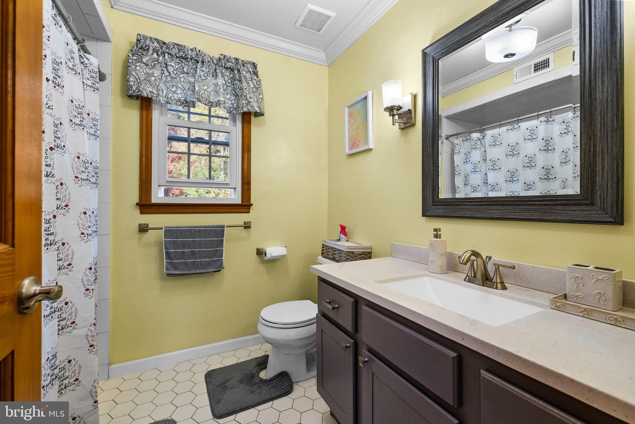 40 Doe Drive Hamilton, NJ 08620 - Photo 41 of 62 a bathroom with a granite countertop toilet sink and mirror