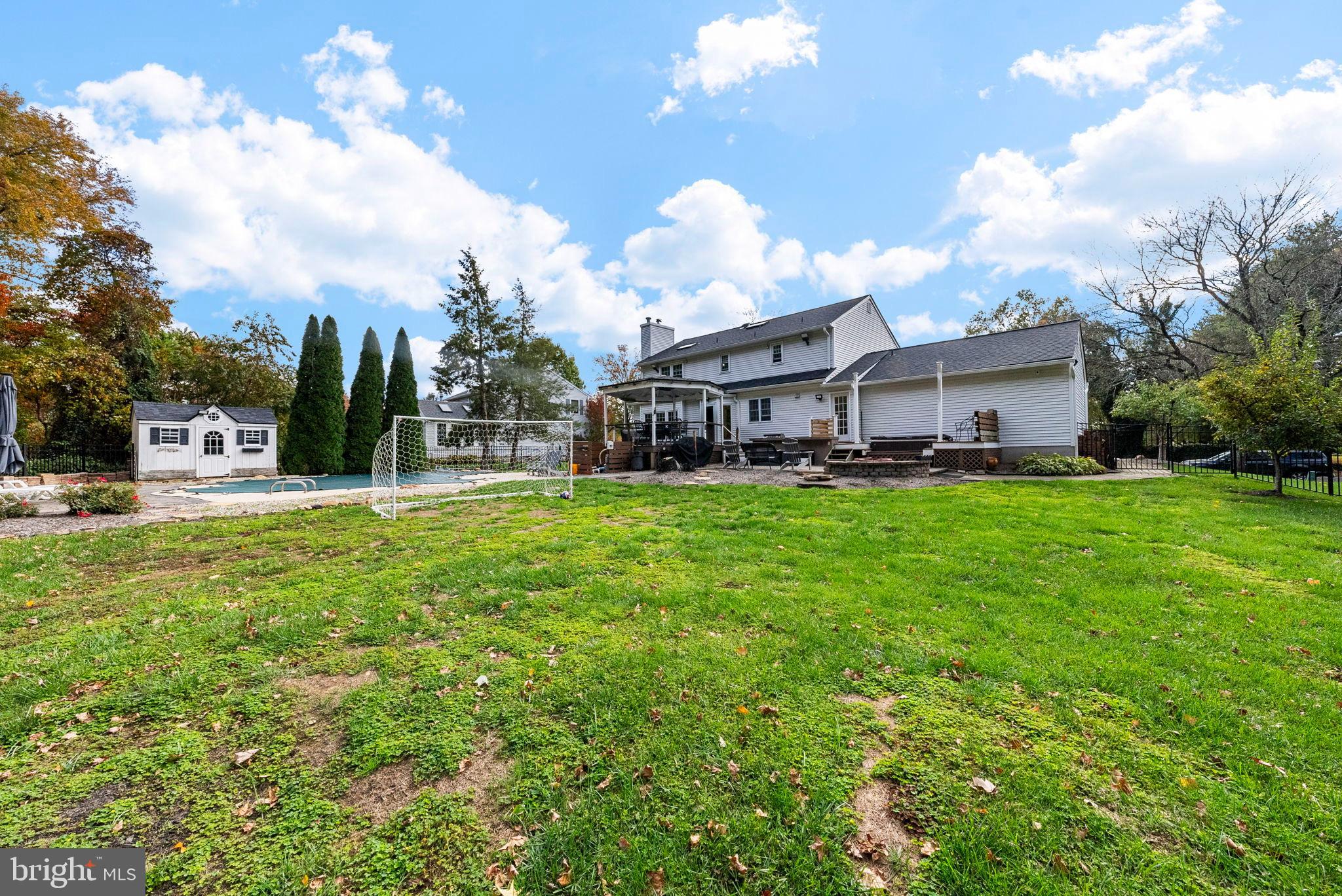 40 Doe Drive Hamilton, NJ 08620 - Photo 44 of 62 a view of a house with a big yard and large trees