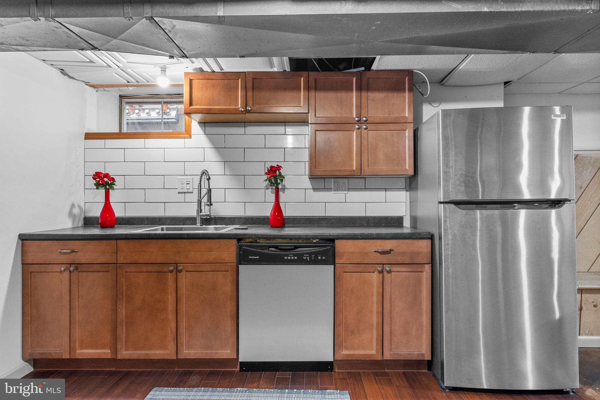 40 Doe Drive Hamilton, NJ 08620 - Photo 55 of 62 a kitchen with stainless steel appliances granite countertop a refrigerator and a sink