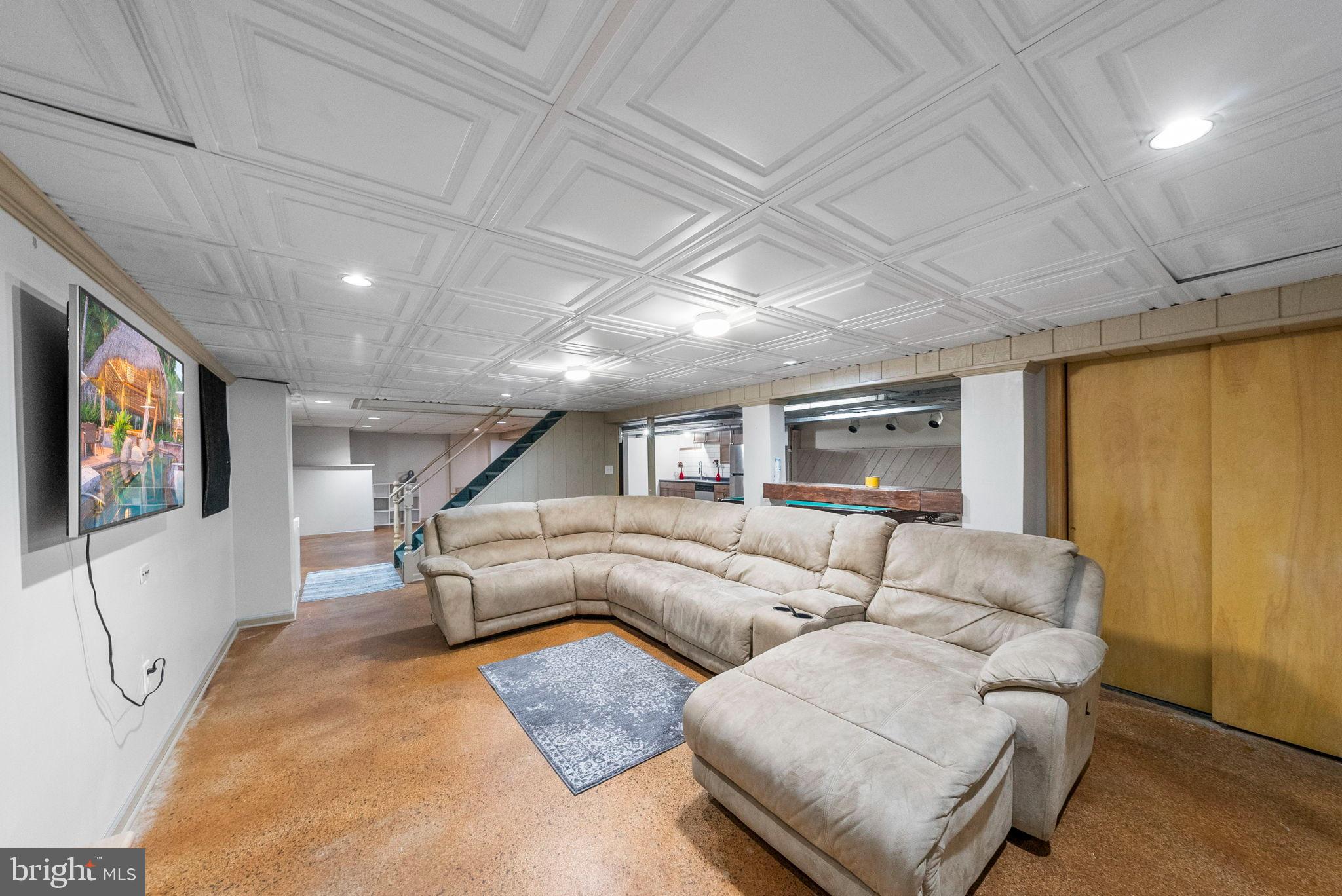 40 Doe Drive Hamilton, NJ 08620 - Photo 58 of 62 a living room with furniture and a flat screen tv