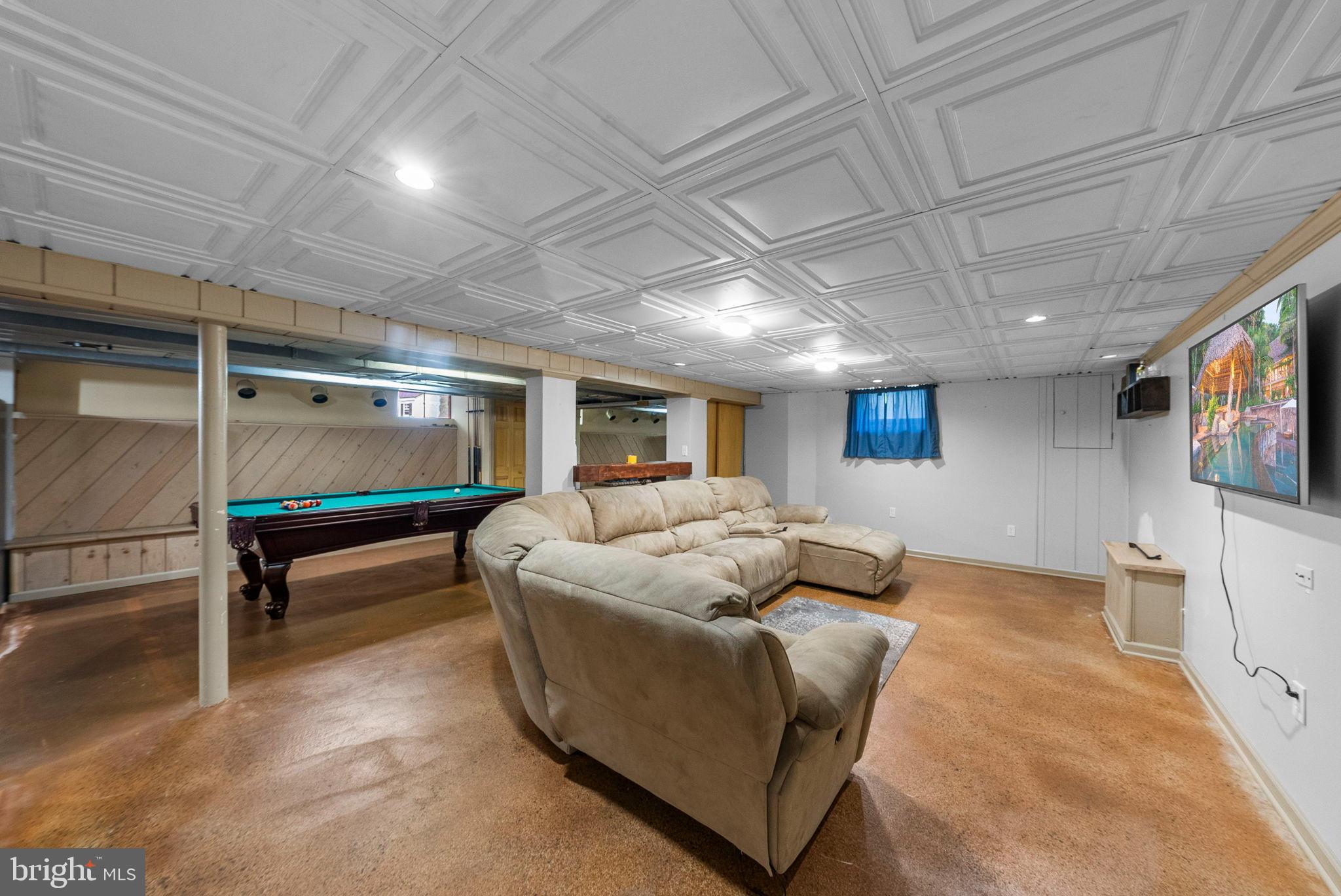 40 Doe Drive Hamilton, NJ 08620 - Photo 59 of 62 a living room with furniture and a flat screen tv