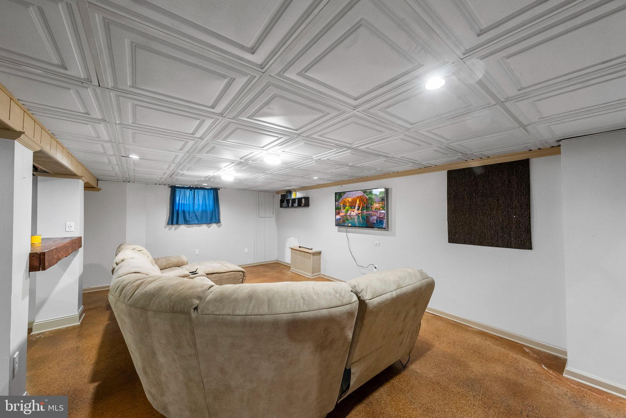 40 Doe Drive Hamilton, NJ 08620 - Photo 60 of 62 a bed room with furniture and a flat screen tv