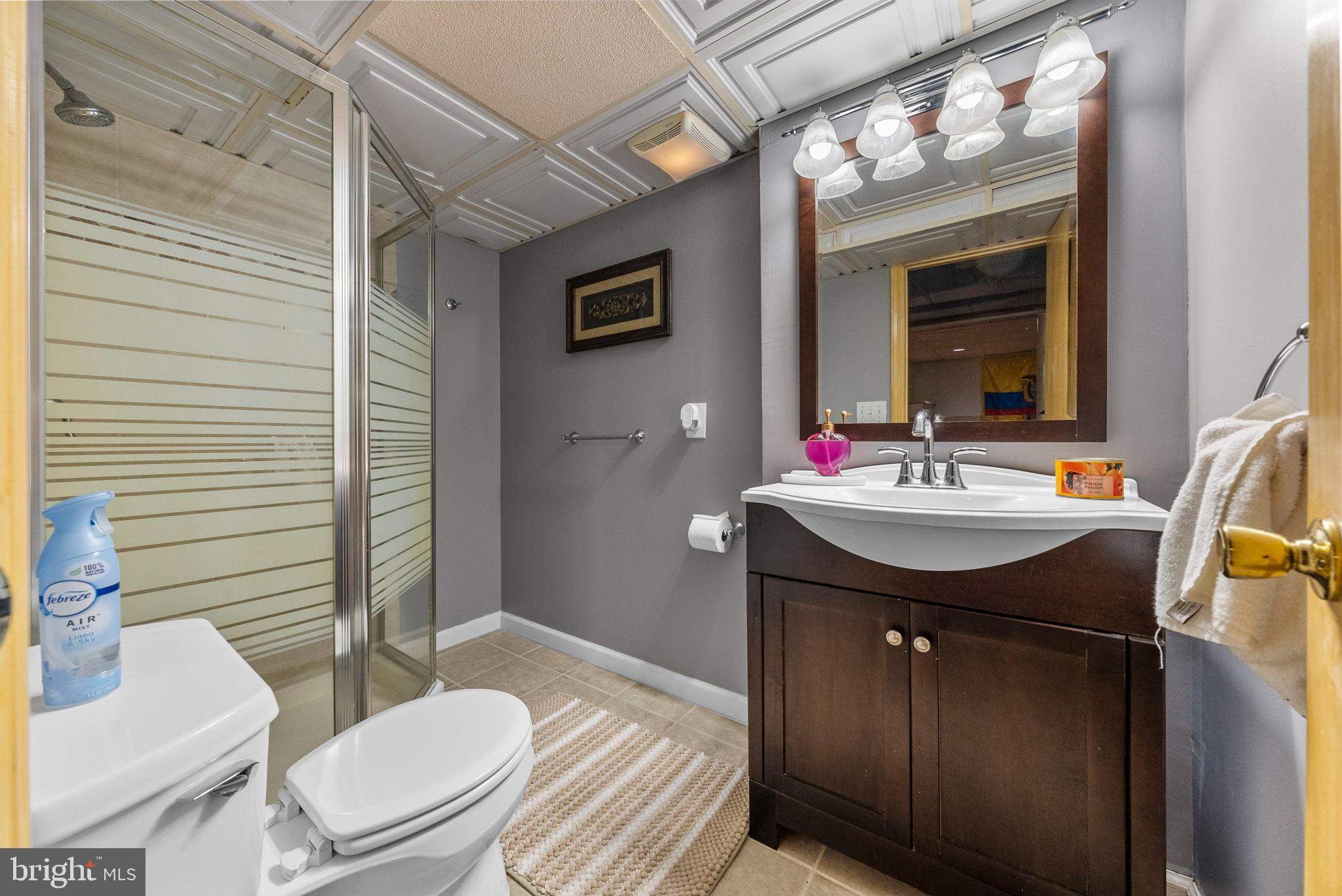 40 Doe Drive Hamilton, NJ 08620 - Photo 62 of 62 a bathroom with a sink and a mirror