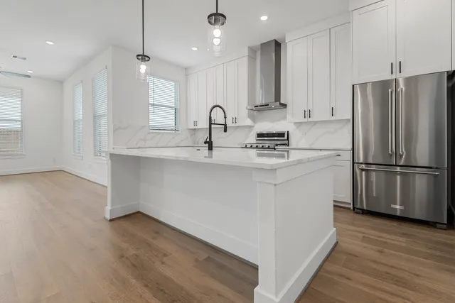 a view of cabinets with wooden floor