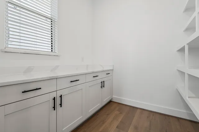 a view of cabinets and wooden floor