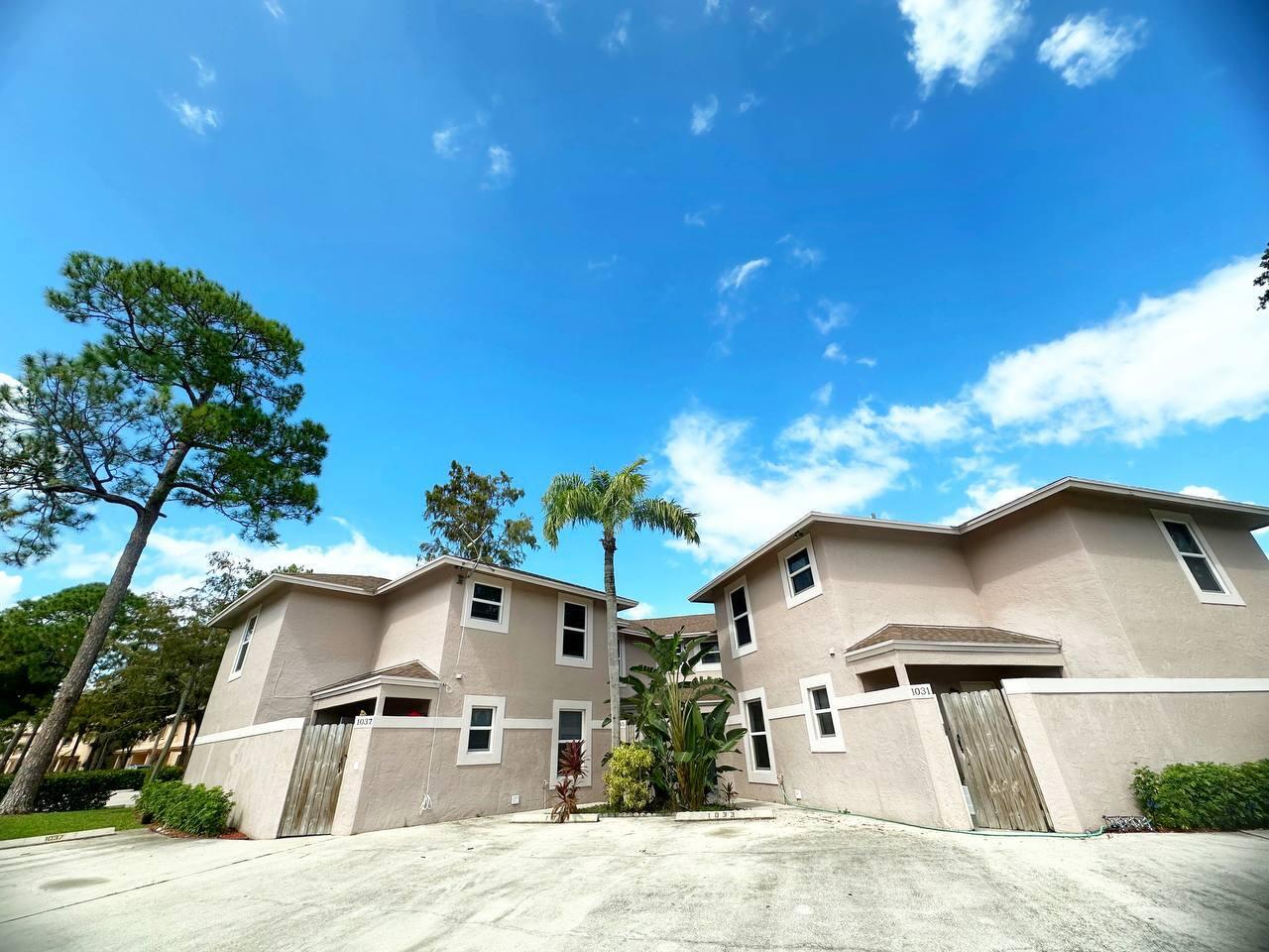 1033 Goldenrod Road Wellington, FL 33414 - Photo 1 of 8 a house view with a garden space