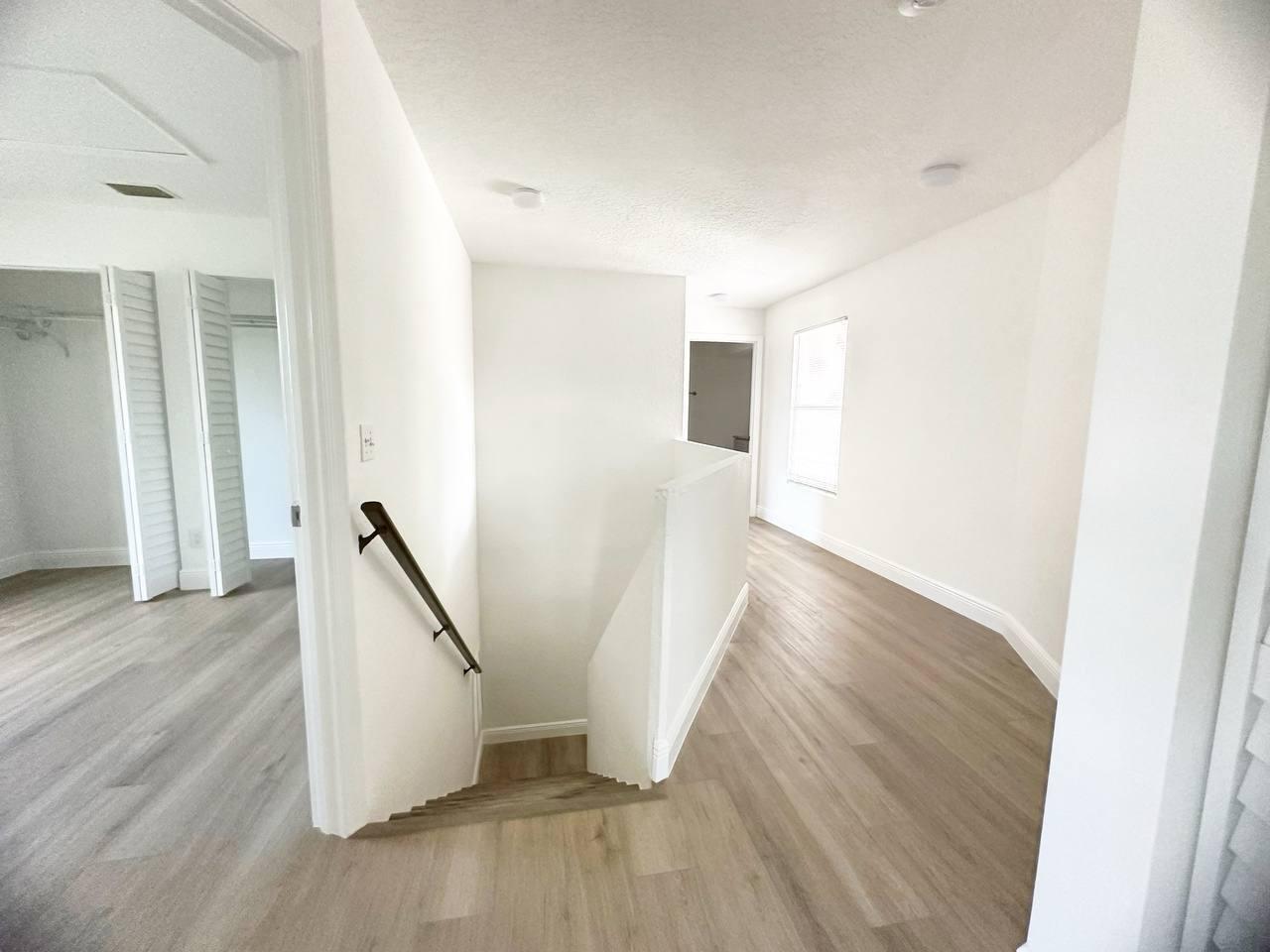 1033 Goldenrod Road Wellington, FL 33414 - Photo 6 of 8 a view of entryway with wooden floor