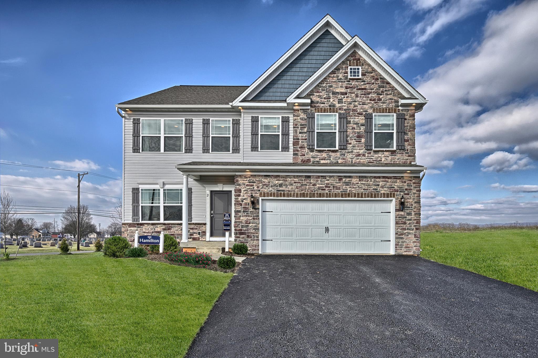 Tbd Paradise View Drive Greencastle, PA 17225 - Photo 1 of 18 a front view of a house with a garden and yard