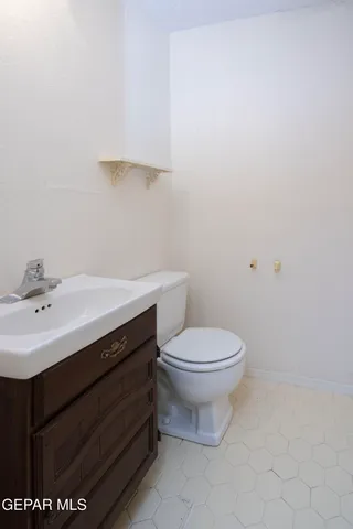 a bathroom with a sink toilet and vanity