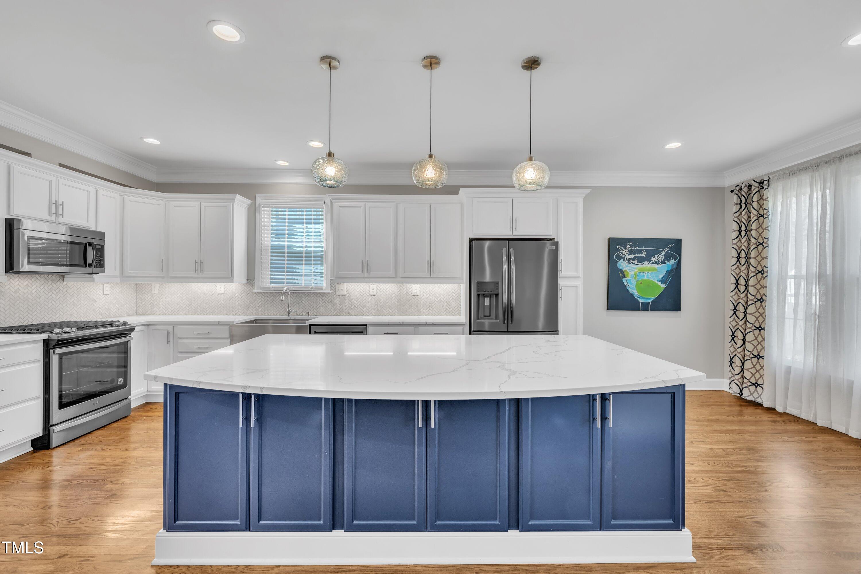 7505 Nichols Road Raleigh, NC 27615 - Photo 11 of 45 completely remodeled kitchen with quartz countertops, all new appliances, including 2 ovens & refrigerator conveys