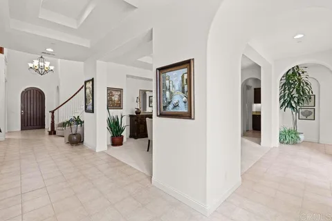 a kitchen with stainless steel appliances granite countertop a stove a sink a kitchen island with a dining table and chairs