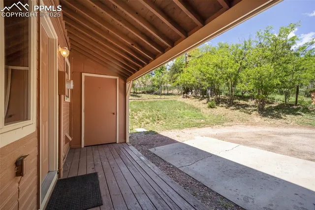 a view of outdoor space with wooden floor