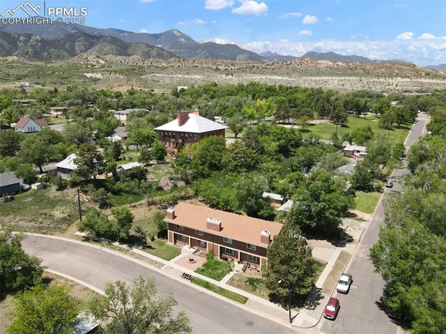 an aerial view of house with yard