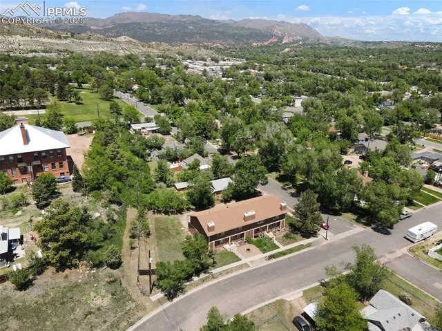an aerial view of a house with a garden