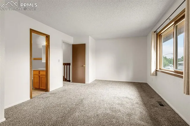 a view of empty room with windows